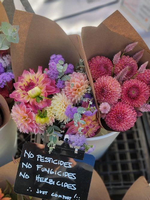 Bouquet of flowers with a label emphasizing no pesticides and no chemicals.